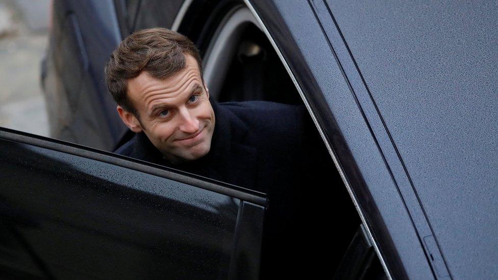 French President Emmanuel Macron leaves after attending a "prise d"armes" military ceremony at the Invalides in Paris, France, November 26, 2018