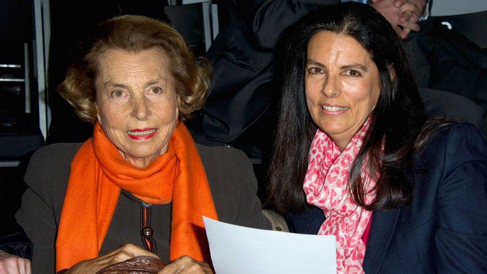 Francoise Bettencourt-Meyers and her mother Liliane Bettencourt at a fashion show in 2012.