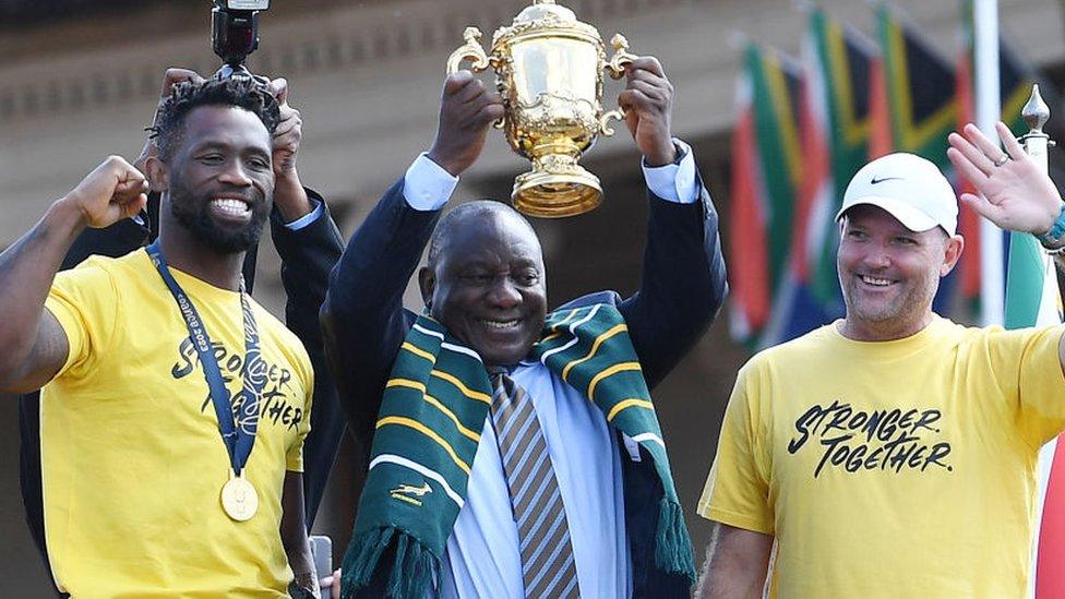 Captain Siya Kolisi, President Cyril Ramaphosa and head coach Jacques Nienaber lift the trophy during the Rugby World Cup 2023 Springbok Trophy Tour in Pretoria at Union Buildings on November 02, 2023