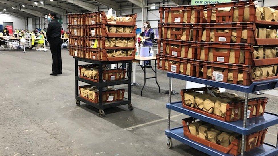 Crates of brown packages, containing food for 300 count staff