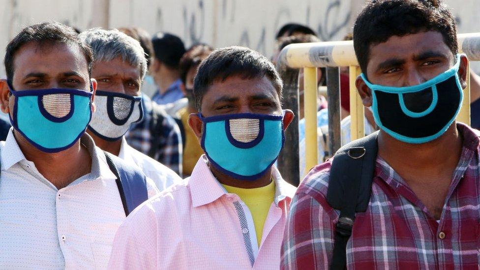 Indian citizens queue at Kuwait International Airport