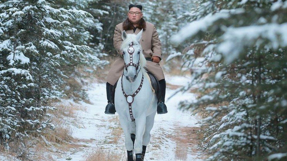 North Korean leader Kim Jong Un rides a horse during snowfall in Mount Paektu