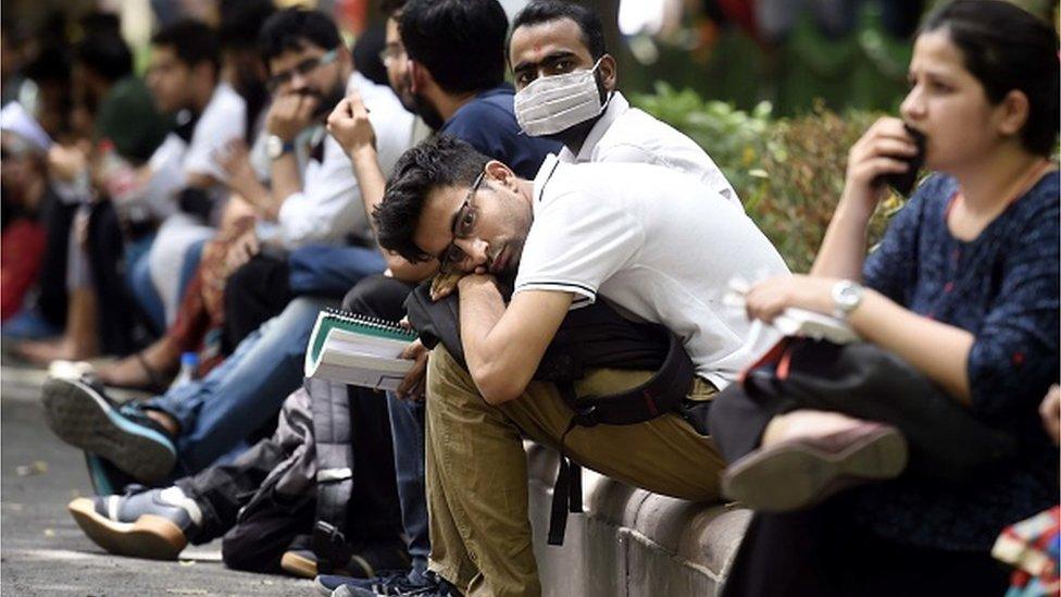 Aspirants outside an examination centre before appearing for the Union Public Service Commission (UPSC) Civil services prelim examination, at Shahjahan Road on June 5, 2022 in New Delhi, India