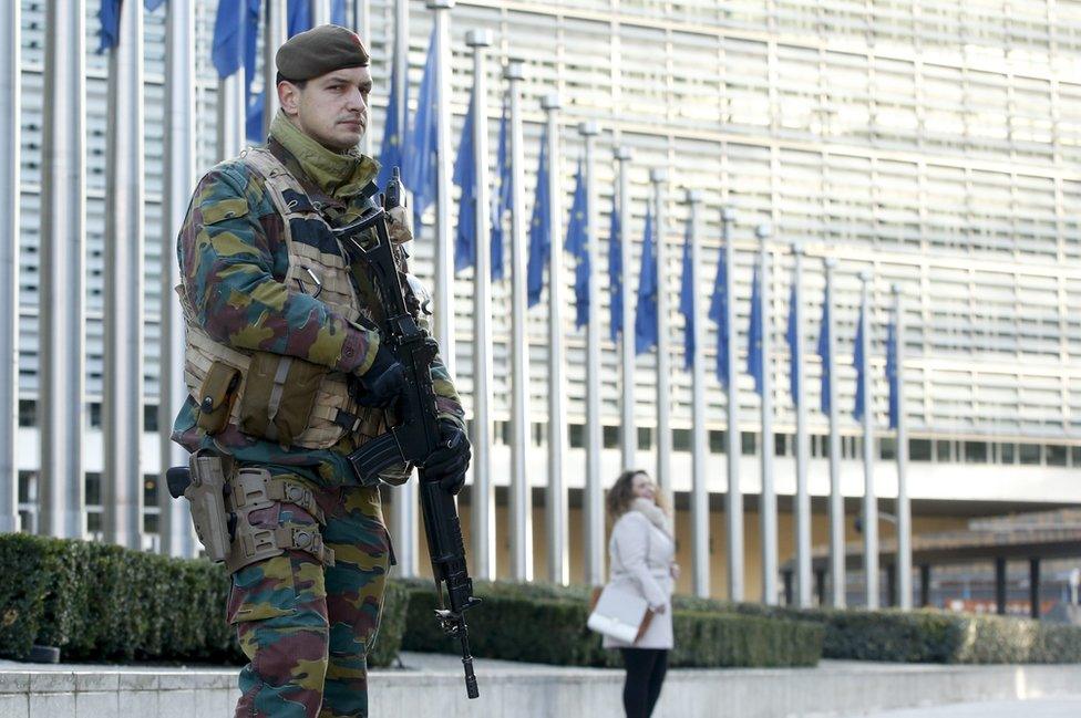 A soldier patrols in front of European commission headquarters following the terror alert level being elevated to 4/4, in Brussels, Belgium, 23 November 2015 23 November 2015