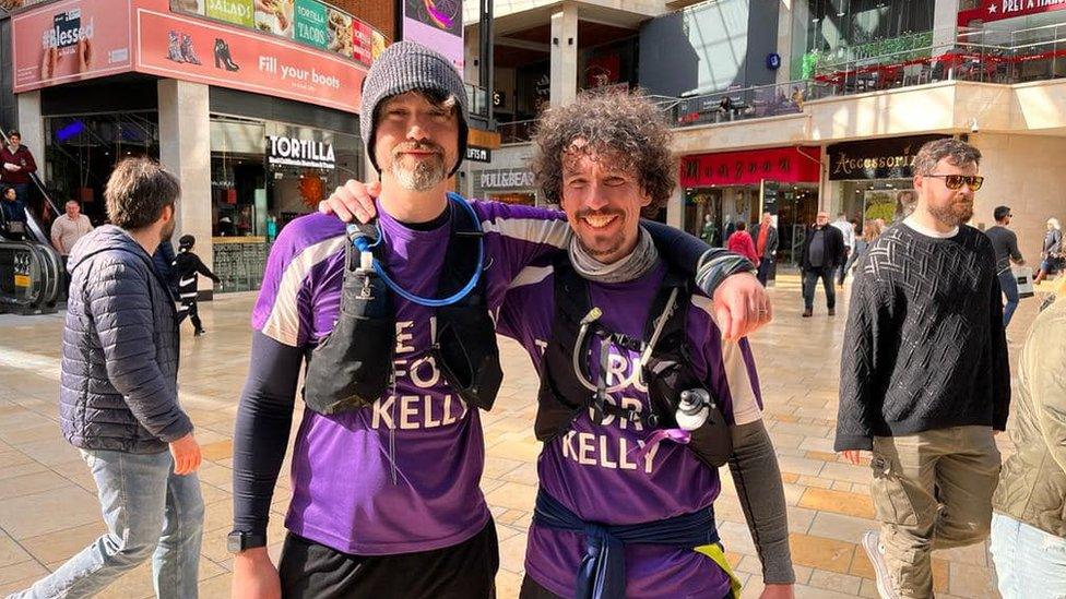 Michael Pendry (left) and John Fielding (right) standing in Bristol's Cabot circus in their running gear