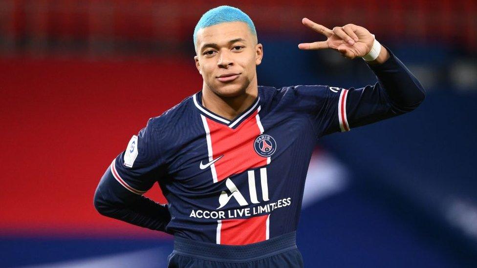 Kylian Mbappe, with blue hair