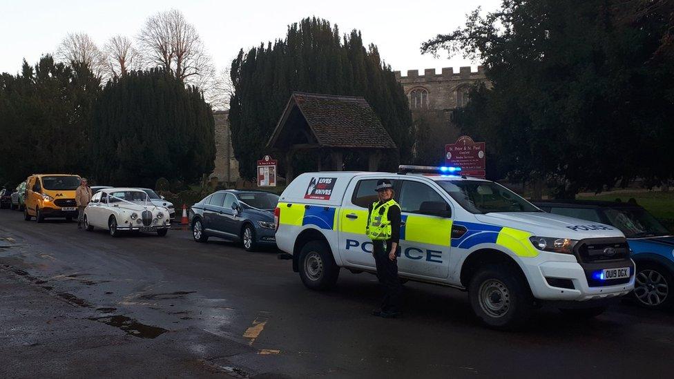 Police escorting the wedding car