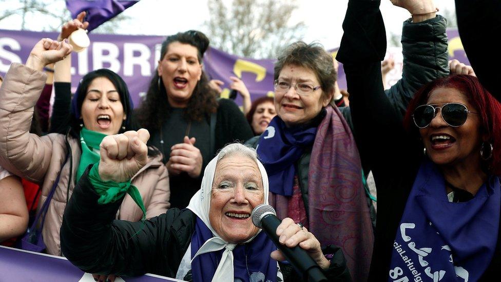 Women attend a demonstration on the occasion of the International Women's Day in Madrid