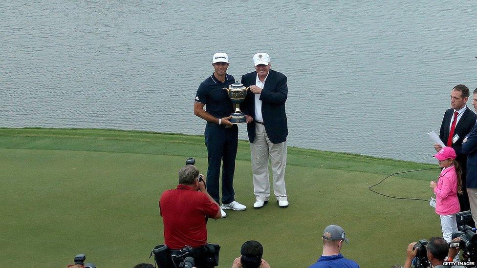 Donald Trump awards a trophy at the Trump National Doral golf course.