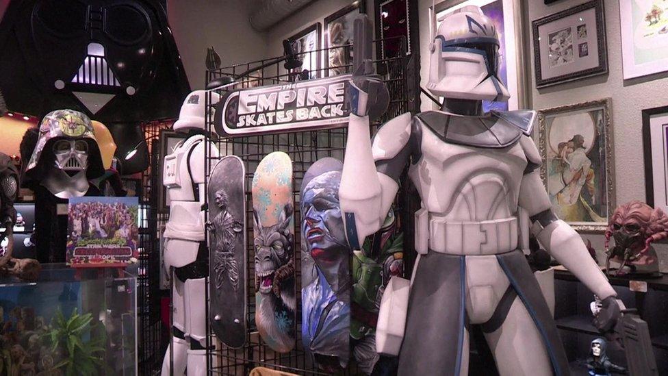 A screengrab from an AFP video shows stormtrooper figures and other memorabilia