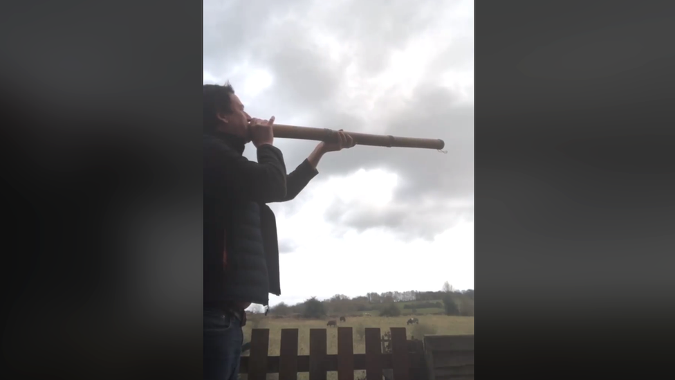 Resident uses a didgeridoo