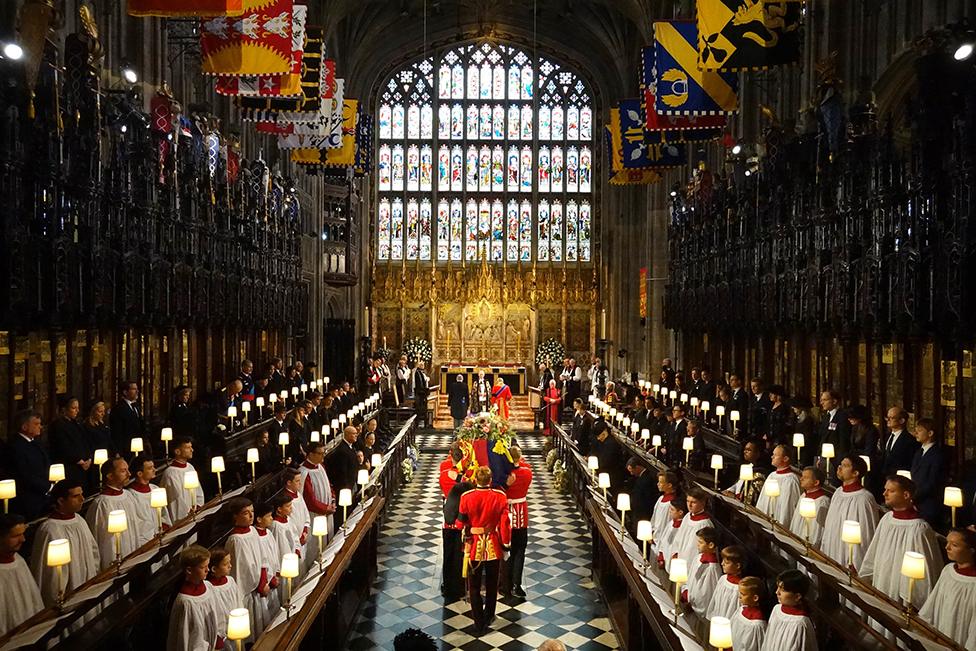 The coffin of Queen Elizabeth II is carried into St George's Chapel in Windsor Castle, Berkshire for her Committal Service