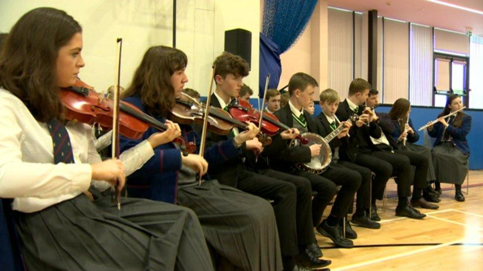 Pupils from Belfast Royal Academy and St Malachy's College share music lessons