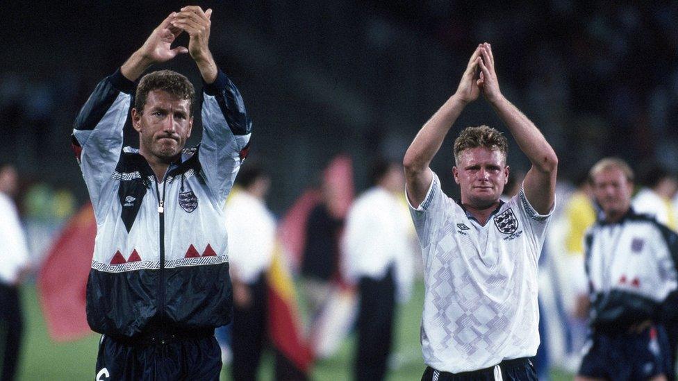 A tearful Paul Gascoigne applauds the England fans alongside Terry Butcher after England were defeated by West Germany in a penalty shoot out.