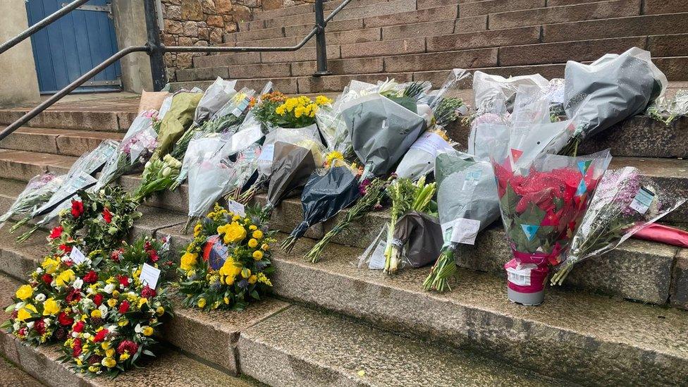 Memorial flowers on steps in St Helier