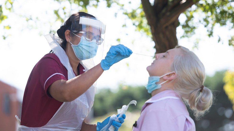 Nurse administering a Covid-19 test