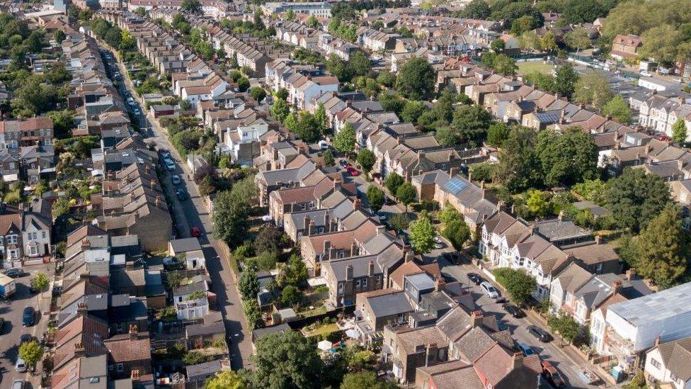 An aerial view of rows of housing