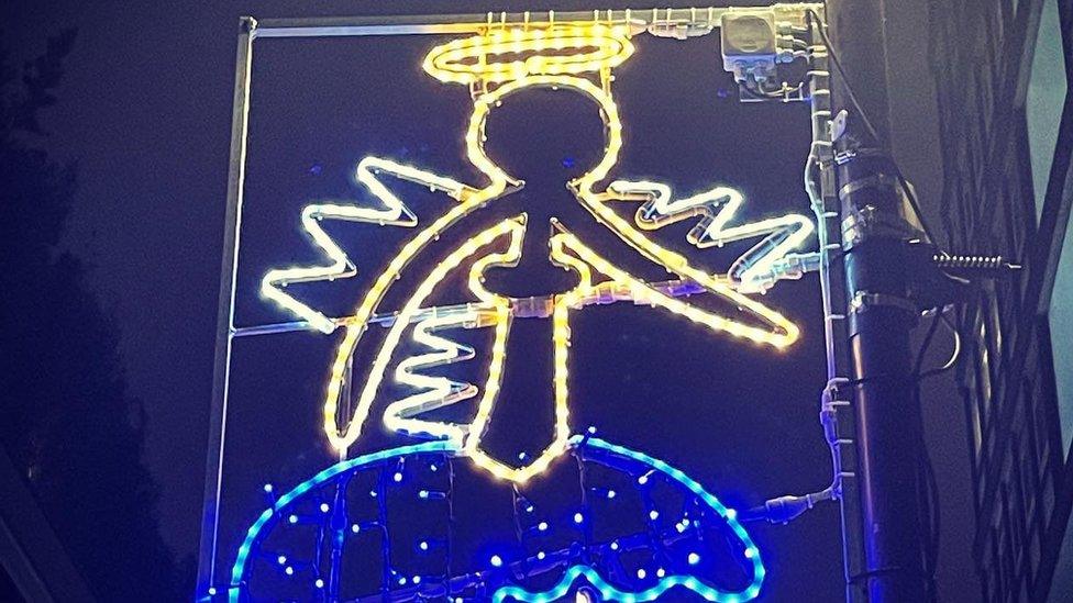 Photo of an Angel Christmas light designed by a pupil at Soho Parish primary school