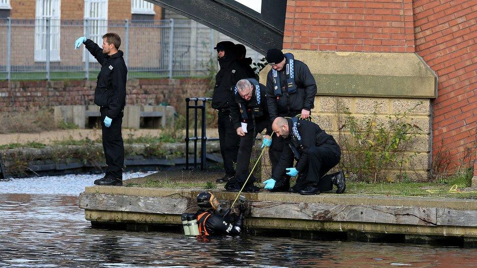 Divers search canal for evidence