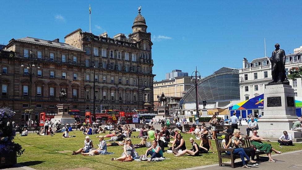 Lots of Glaswegians sunning themselves in George Square this afternoon