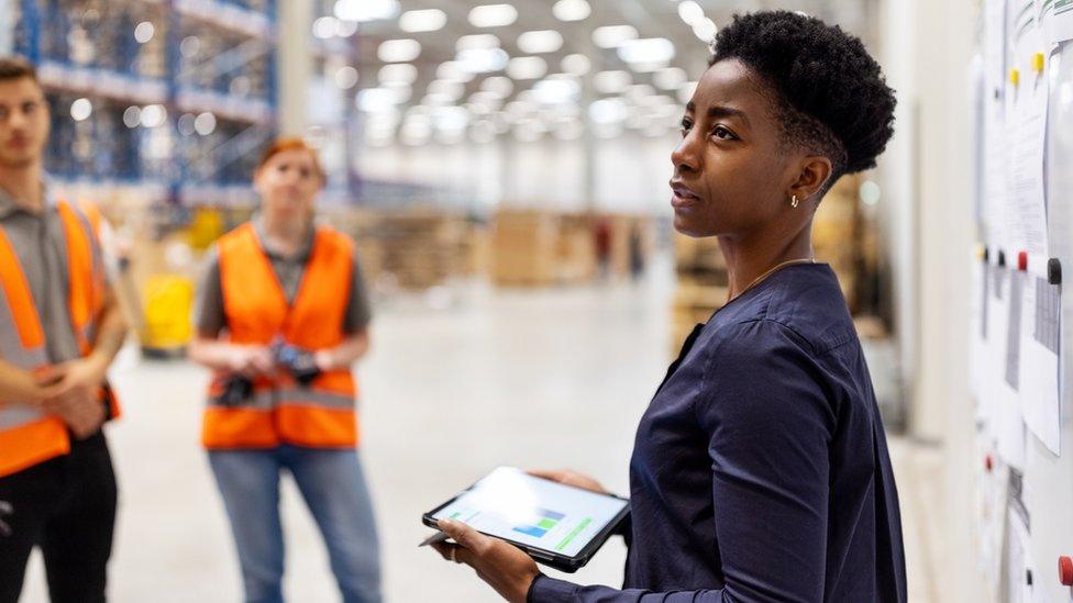 A stock image of people in the workplace