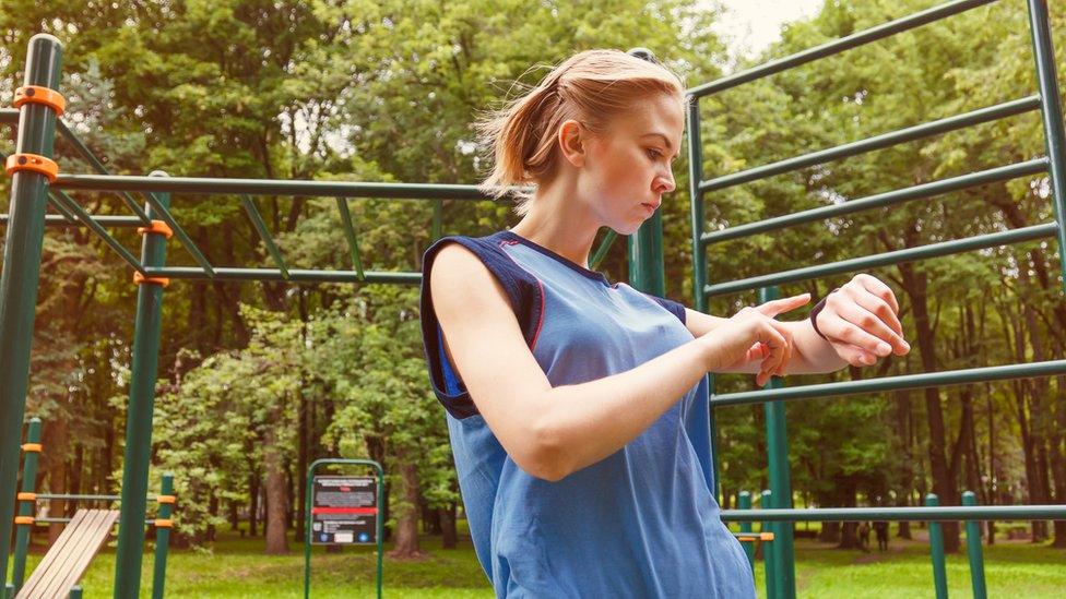 Woman using a fitness tracker