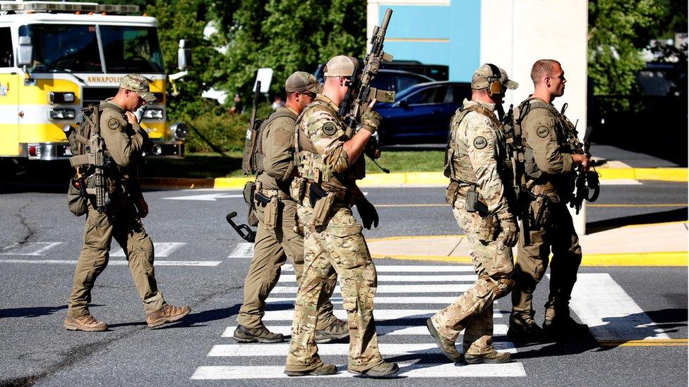 Tactical police gather at shooting scene outside the Capital Gazette newspaper in Annapolis, Maryland, 28 June 2018