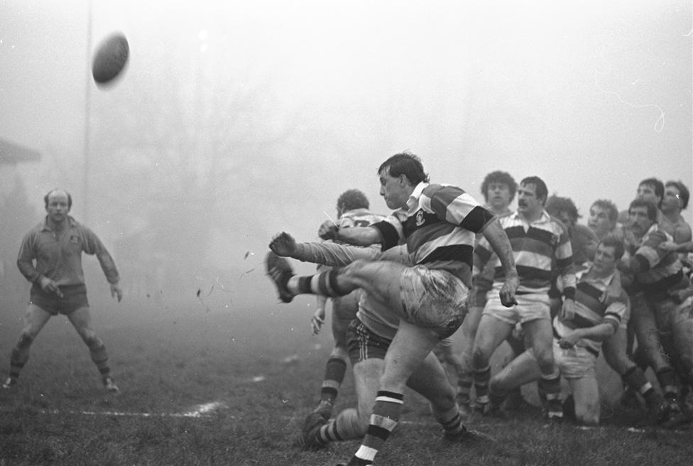 David Bishop kicks the ball for touch during a match against Australia in 1984