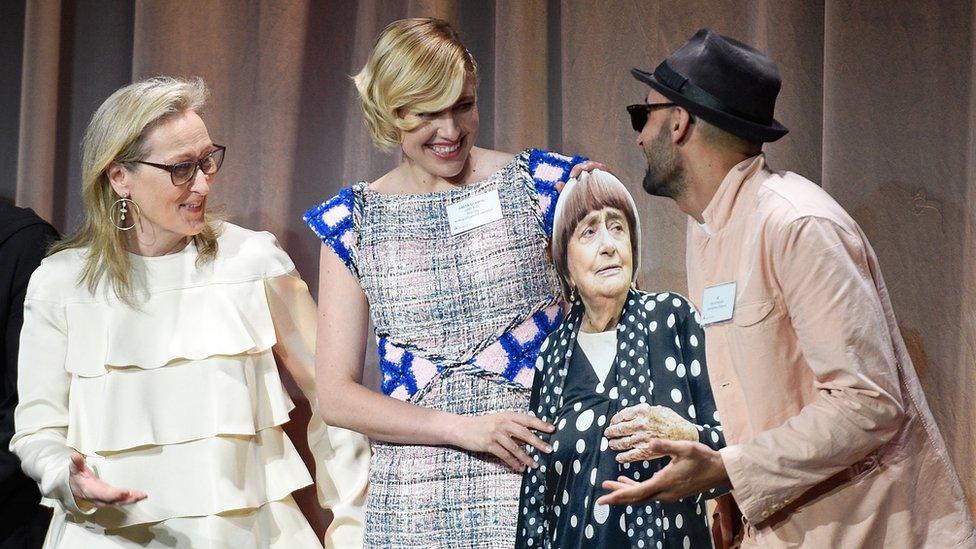 Meryl Streep (l), Greta Gerwig (centre) and JR (r) with a cardboard cut-out of Varda