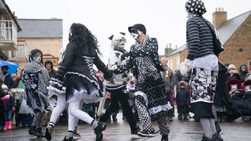 Straw bear dancers