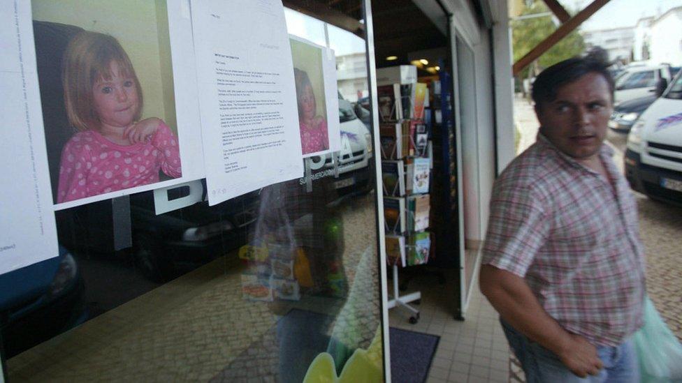 Photographs of Madeleine McCann are pasted onto a shop front on 4 May 2007 in the area of the Ocean Club apartment hotel in Praia da Luz in Portugal