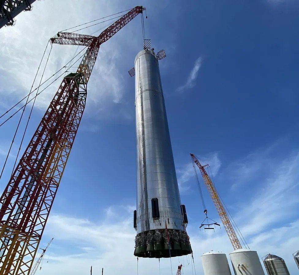 A Super Heavy booster is worked on at Starbase in Texas