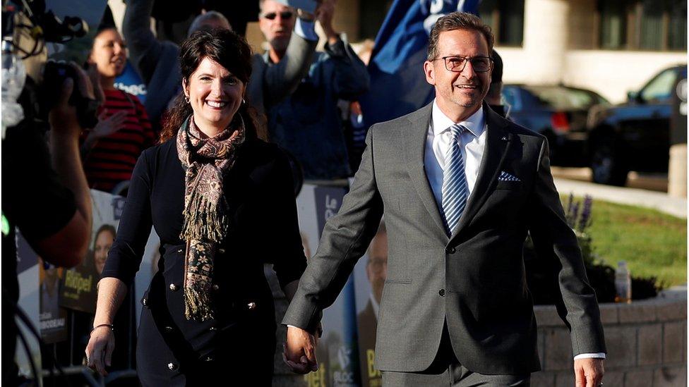 Bloc Québécois leader Yves-Francois Blanchet, accompanied by his wife, arrives for the federal election debate