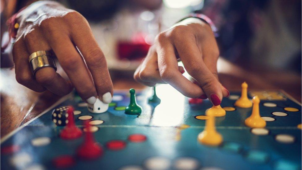 Two people playing a board game