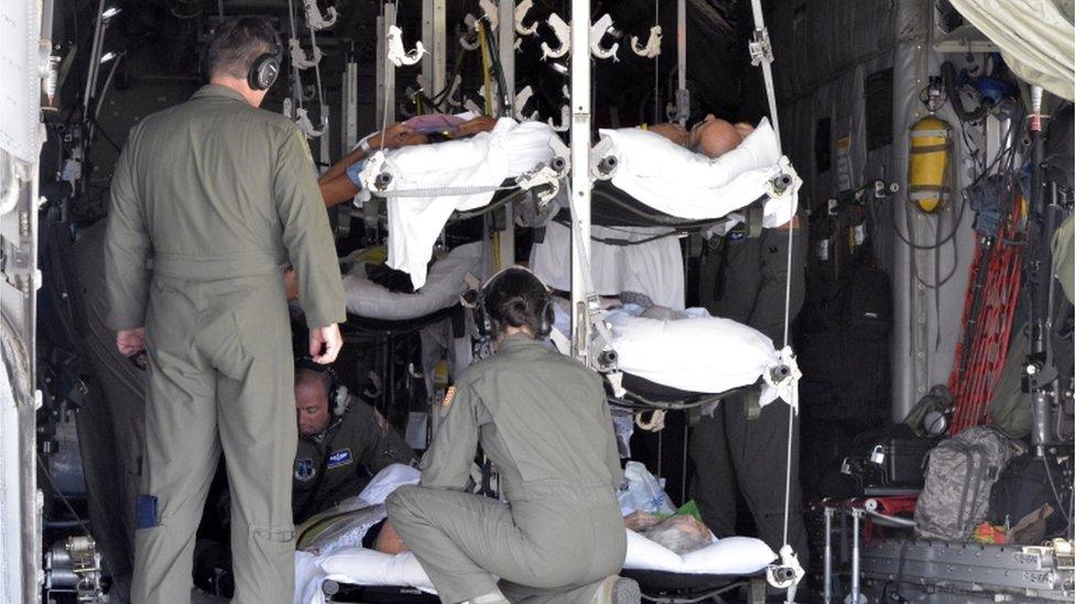 Patients piled into an emergency aircraft evacuation