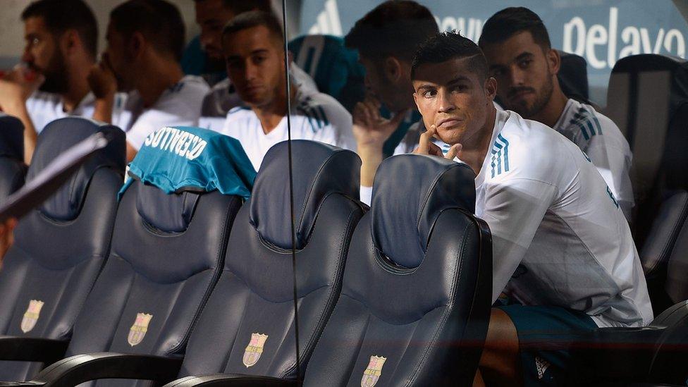 Ronaldo and teammates sitting on bench