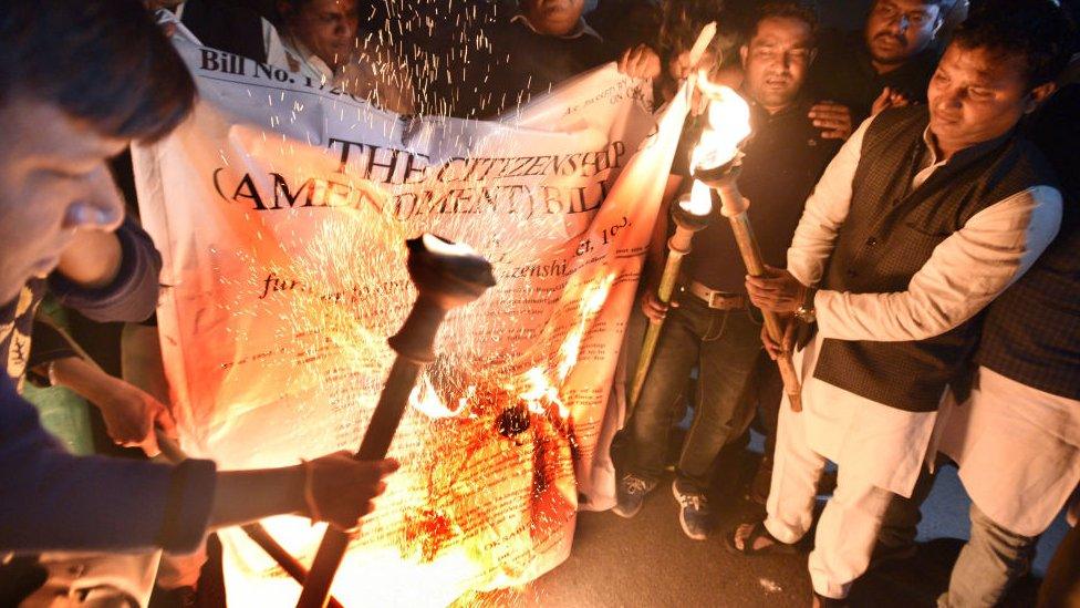 NYC National President Srinivas B.V with party supporters during a torch procession against the Citizenship Amendment Bill at Rajpath near India Gate, on December 11, 2019 in New Delhi, India. Normal life came to a halt on Tuesday in several states amid protests over the Citizenship (Amendment) Bill.