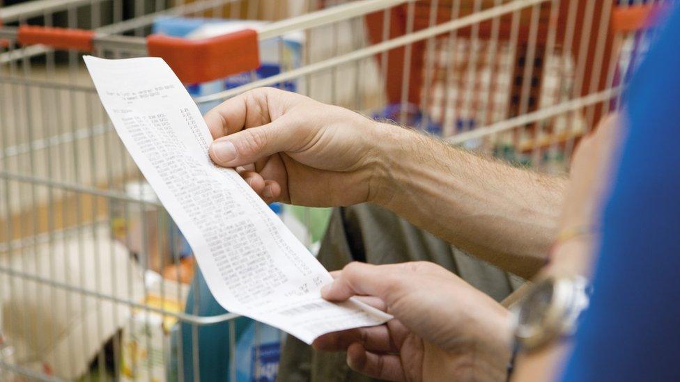 a person looking at a receipt