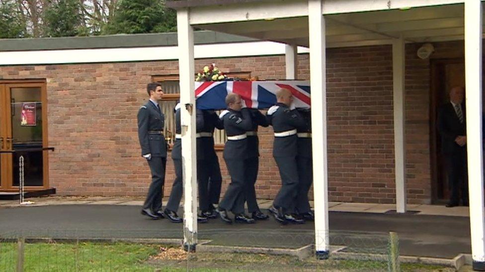 RAF servicemen carrying the coffin