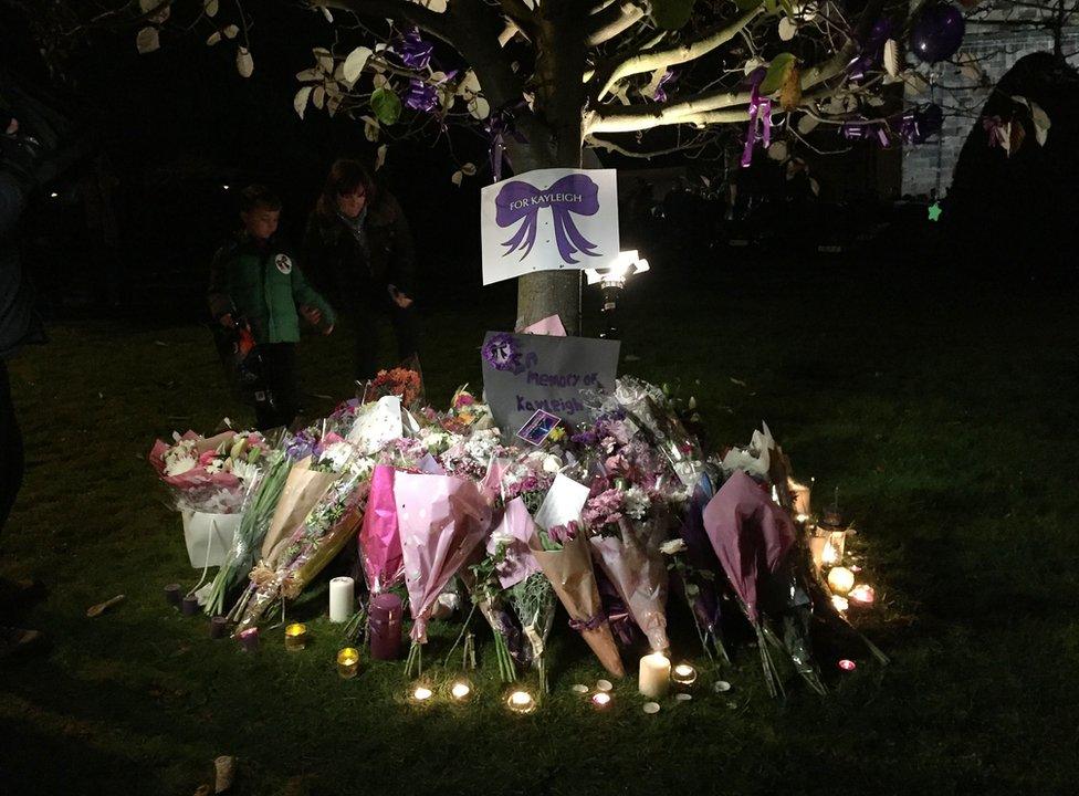 Flowers are left outside the St Laurence Church in Measham, Leicestershire, where a vigil was held for Kayleigh Haywood