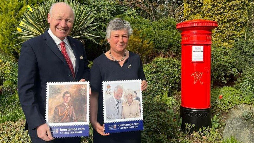 Sir John Lorimer and wife Lady Lorimer with stamps from the collection