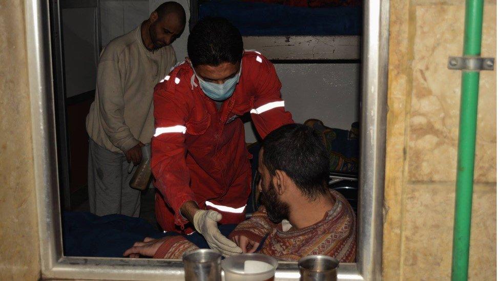 Red Crescent worker with disabled man, Aleppo Wednesday 7 December 2017