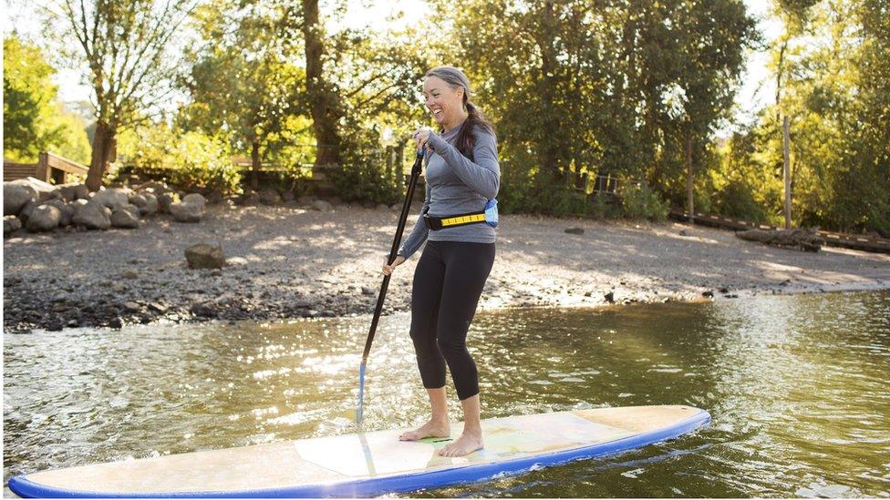 Woman paddleboarding