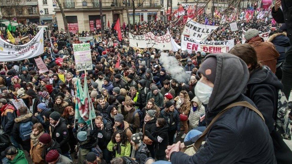 Public and private workers demonstrate and shout slogans during a demonstration against pension reforms in Paris on 5 December, 2019.