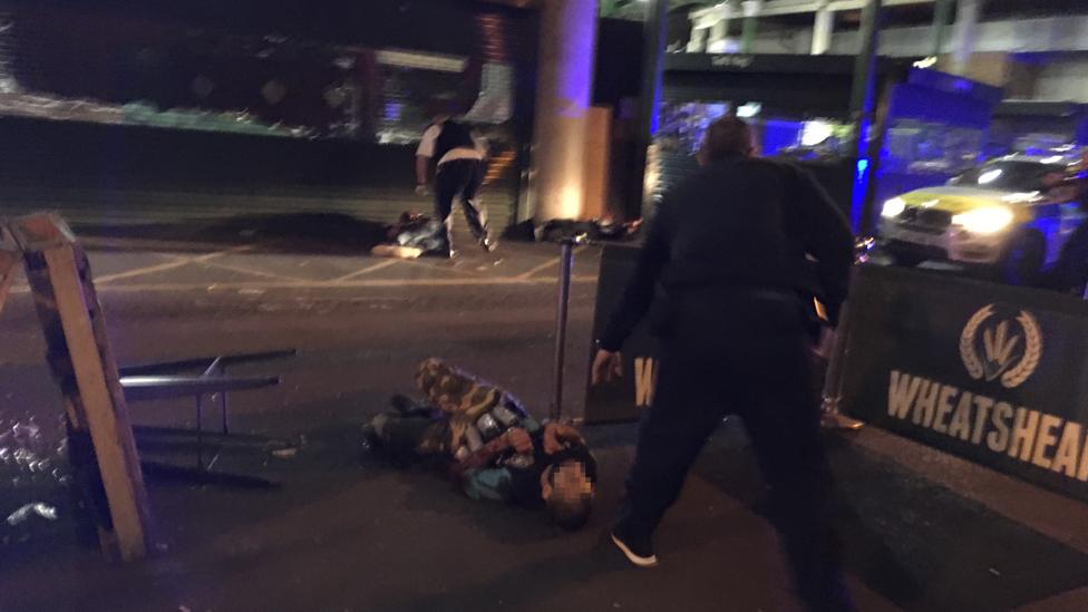 Man on ground at Borough Market