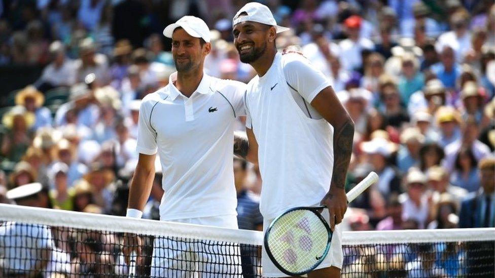 Nick Kyrgios of Australia and Novak Djokovic of Serbia meet at the net before the start of the men's final match at the Wimbledon Championships.