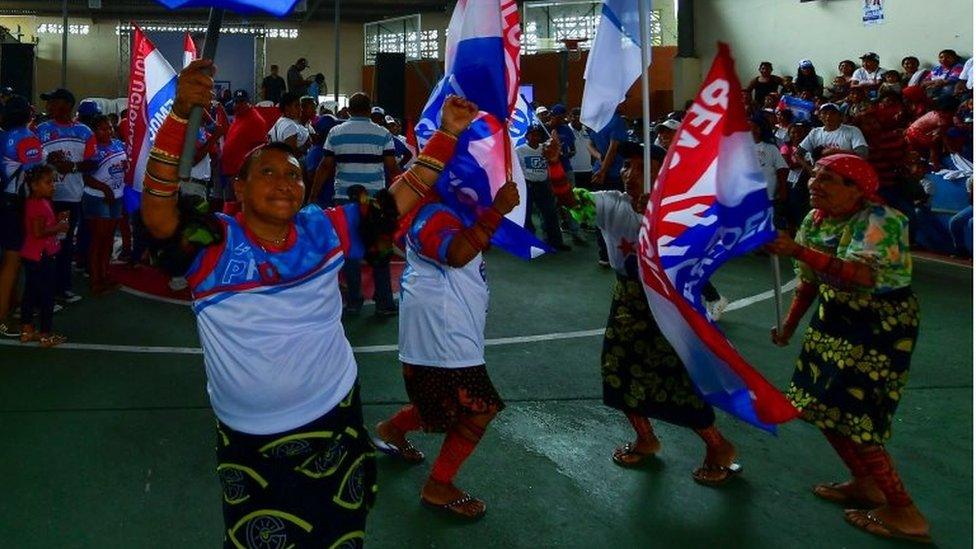 Voters dance during a campaign rally of Panamanian presidential candidate Laurentino Cortizo, of the Democratic Revolutionary Party (PRD), in Arraijan, near Panama City, on April 14, 2019.