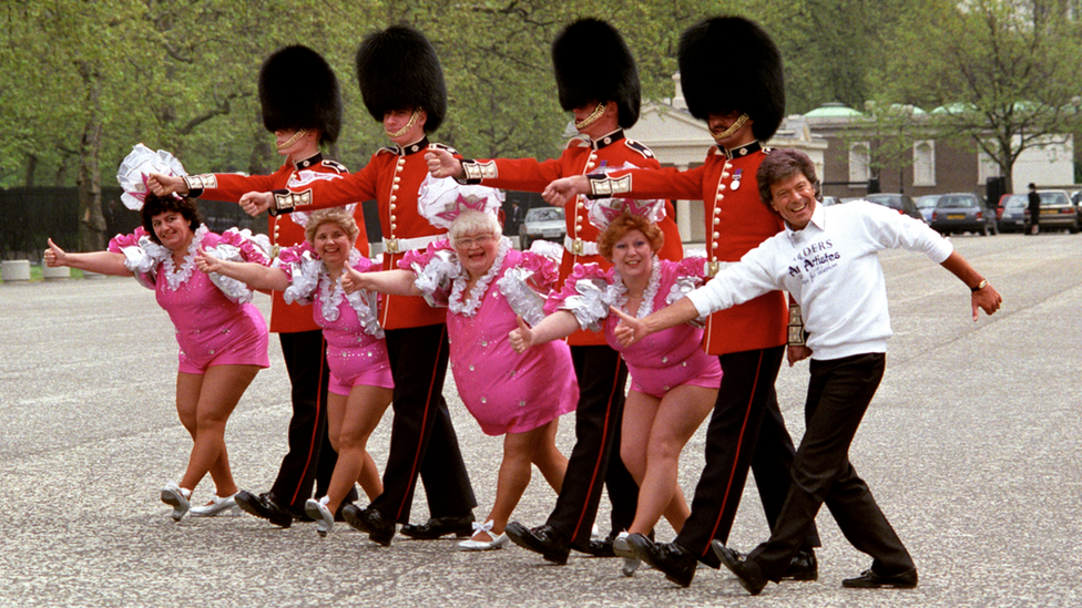 Mo Moreland (centre with white hair) and the Roly Polys with Lionel Blair in London