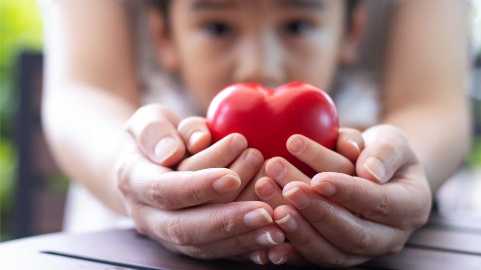 boy-holding-heart.