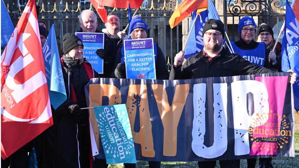 Teaching union members with banners